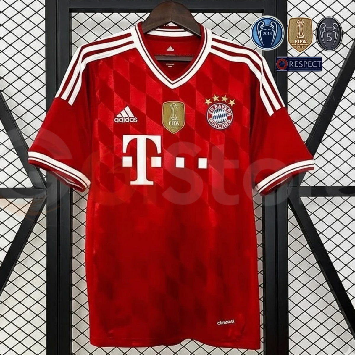 Front view of a red Bayern Munich retro short-sleeve home jersey with a geometric chest pattern, white V-neck trim, white shoulder stripes and a gold FIFA badge.