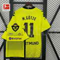 Borussia Dortmund yellow retro jersey, front and back views with M. Götze 11 print, black square pattern and Evonik sponsor, alongside a Bundesliga logo graphic.
