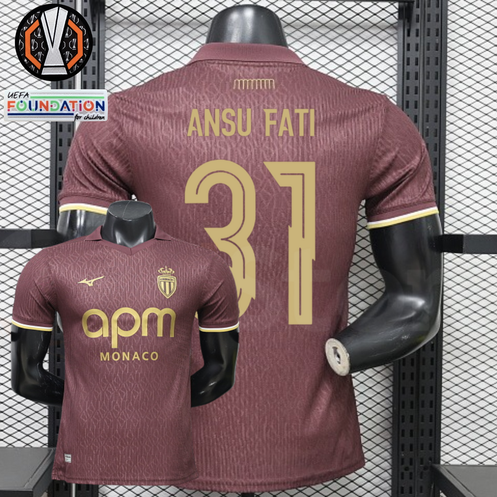AS Monaco burgundy short-sleeve jersey, front and back views with gold ANSU FATI 31 print, tonal pattern and APM Monaco sponsor, alongside Europa League graphics.
