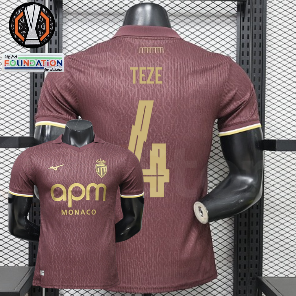 AS Monaco burgundy short-sleeve jersey, front and back views with gold TEZE 4 print, tonal pattern and APM Monaco sponsor, alongside Europa League graphics.
