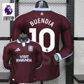 Front and back views of a claret Aston Villa long-sleeve jersey with a light blue collar, white Buendia number 10 print and Visit Rwanda sponsor, alongside Premier League graphics.