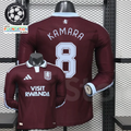 Front and back views of a claret Aston Villa long-sleeve jersey with a light blue collar, light blue Kamara number 8 print and Visit Rwanda sponsor.
