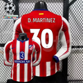  Front and back views of a red and white Atlético Madrid long-sleeve jersey with blue trim, white D. Martínez number 30 print and Riyadh Air sponsor, alongside UCL graphics.