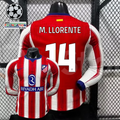 Front and back views of a red and white Atlético Madrid long-sleeve jersey with blue trim, white M. Llorente number 14 print and Riyadh Air sponsor, alongside UCL graphics.