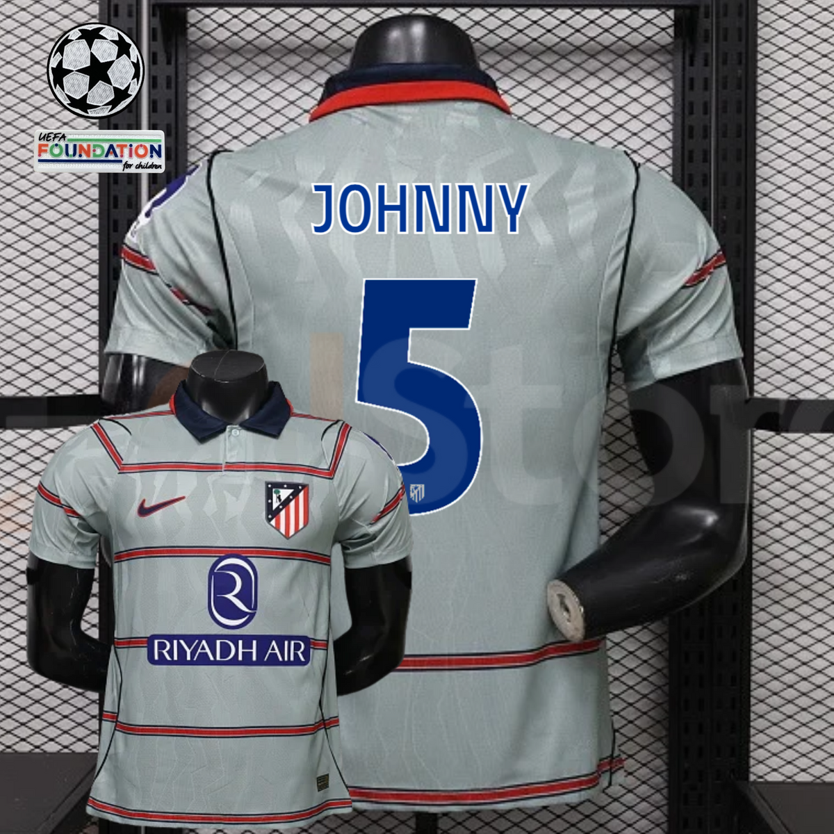  Front and back views of a light grey Atlético Madrid short-sleeve jersey with red horizontal stripes, blue Johnny number 5 print and Riyadh Air sponsor, alongside UCL graphics.