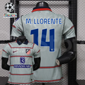  Front and back views of a light grey Atlético Madrid short-sleeve jersey with red horizontal stripes, blue M. Llorente number 14 print and Riyadh Air sponsor, alongside UCL graphics.