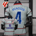  Front and back views of a light grey Atlético Madrid short-sleeve jersey with red horizontal stripes, blue Mendoza number 4 print and Riyadh Air sponsor, alongside a LaLiga graphic.