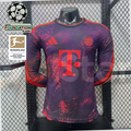 Front view of a purple Bayern Munich long-sleeve third jersey with red patterns, red club crest and Telekom sponsor, alongside UCL and Bundesliga badge graphics.
