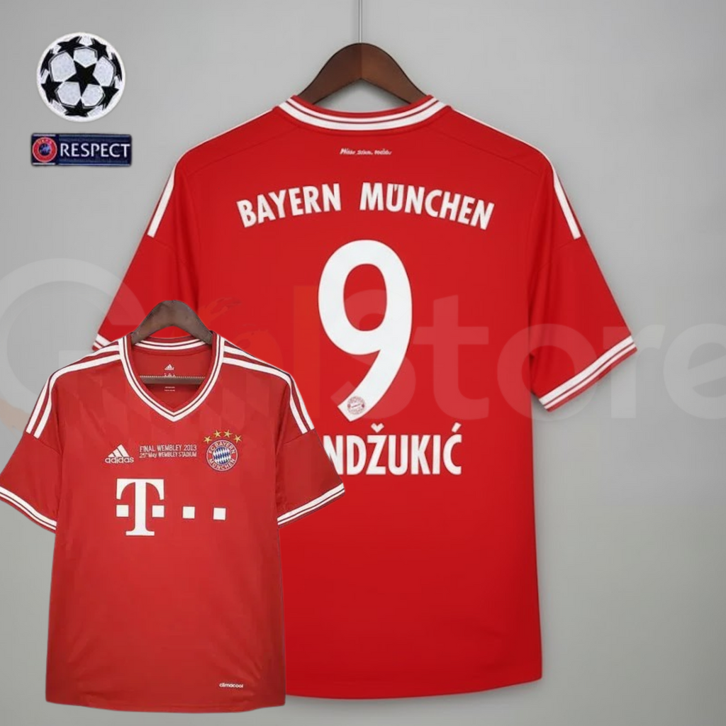 Front and back views of a red Bayern Munich short-sleeve jersey with white trim, “Final Wembley 2013” chest lettering and Mandžukić 9 printing on the back.
