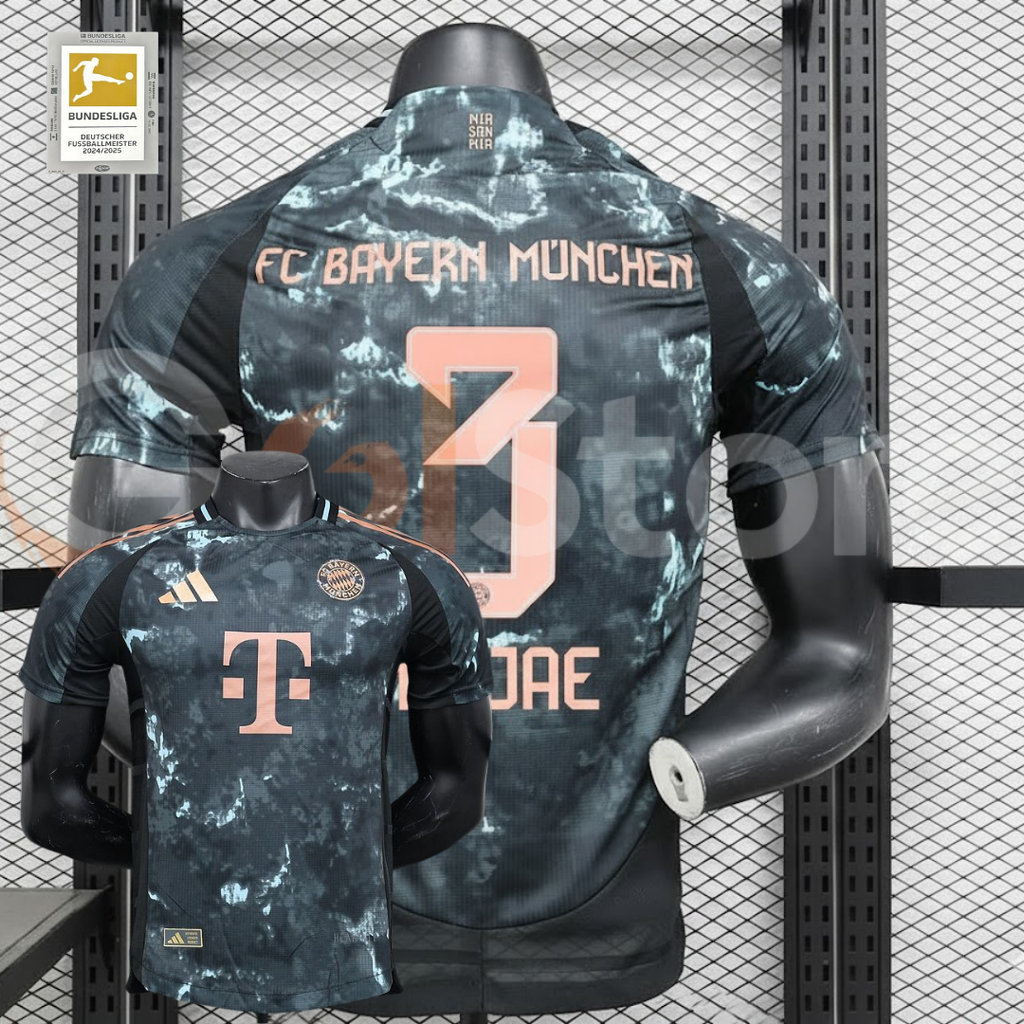 Bayern Munich 2024–2025 short-sleeve away jersey, front and back views, with a dark grey pattern, black panels and copper-coloured MINJAE number 3 printing.