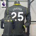 Chelsea dark grey long-sleeve jersey shown from the front and back, with white CAICEDO 25 print, neon yellow details and a gold FIFA World Champions chest badge.
