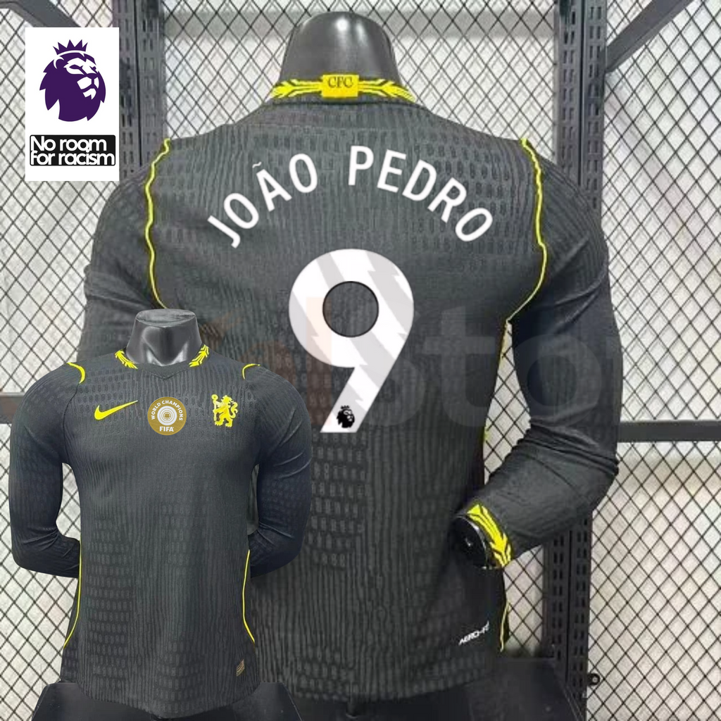 Chelsea dark grey long-sleeve jersey shown from the front and back, with white JOÃO PEDRO 9 print, neon yellow details and a gold FIFA World Champions chest badge.
