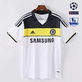 Front view of a white Chelsea FC retro short-sleeve jersey with a black upper panel, yellow chest band, black shoulder stripes, Chelsea crest and Samsung sponsor.