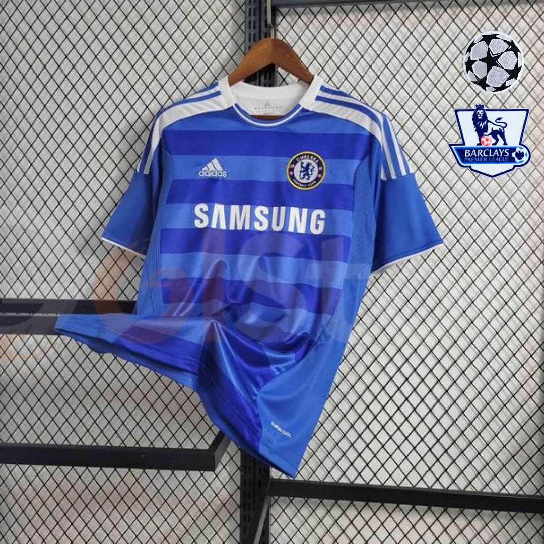 Front view of a blue Chelsea FC 2011–2012 retro short-sleeve home jersey with horizontal tonal stripes, white shoulder stripes, Chelsea crest and Samsung sponsor.