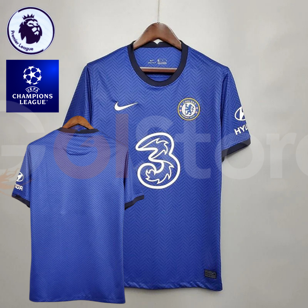 Front and back views of a blue Chelsea FC 2020–2021 short-sleeve home jersey with subtle chevron patterns, dark trim, white sponsor logo and no name or number on the back.