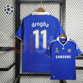 Front and back views of a blue Chelsea FC retro home jersey with white Drogba #11 printing, white collar, yellow trim, Samsung sponsor and Moscow 2008 final chest embroidery.