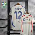 France 2006 retro white short-sleeve away jersey, front and back views with blue Henry #12 lettering, red and blue detailing, and World Cup sleeve patches.