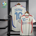 France 2006 retro white short-sleeve away jersey, front and back views with blue Zidane #10 lettering, red and blue detailing, and a World Cup sleeve patch.