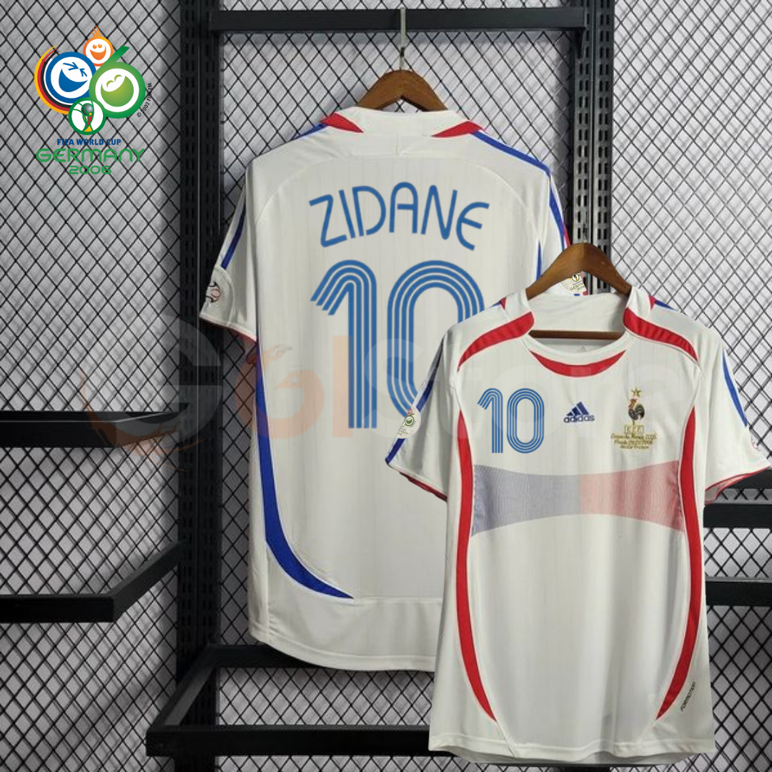 France 2006 retro white short-sleeve away jersey, front and back views with blue Zidane #10 lettering, red and blue detailing, and a World Cup sleeve patch.