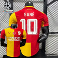 Front and back views of a red and yellow Galatasaray short-sleeve home jersey with white Sané number 10 print and Pasifik Holding sponsor.