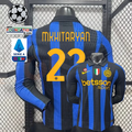 Front and back views of a blue and black striped Inter Milan long-sleeve jersey with yellow Mkhitaryan number 22 print, club crest and Betsson Sport sponsor, alongside UCL and Serie A graphics.