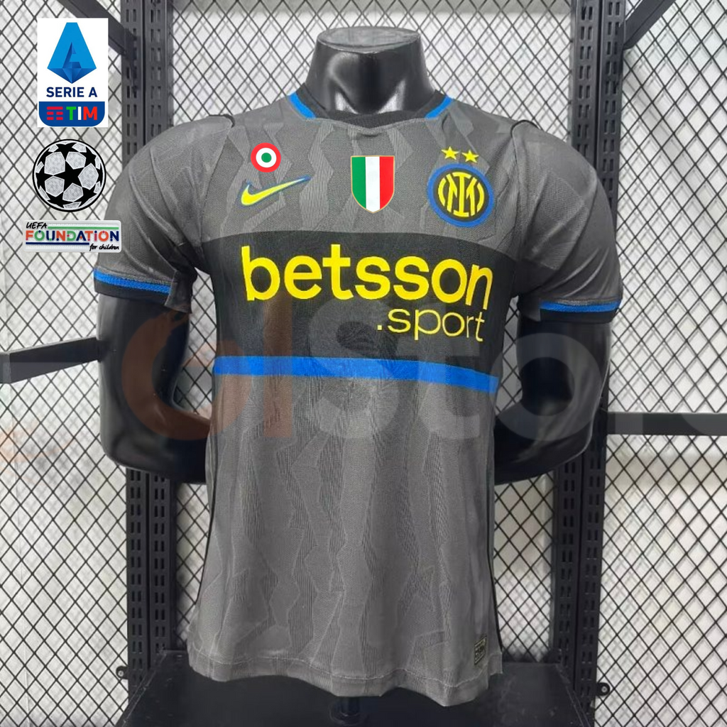 Front view of a grey Inter Milan short-sleeve third jersey with a black chest band, blue trim, yellow Betsson Sport sponsor and club crest.