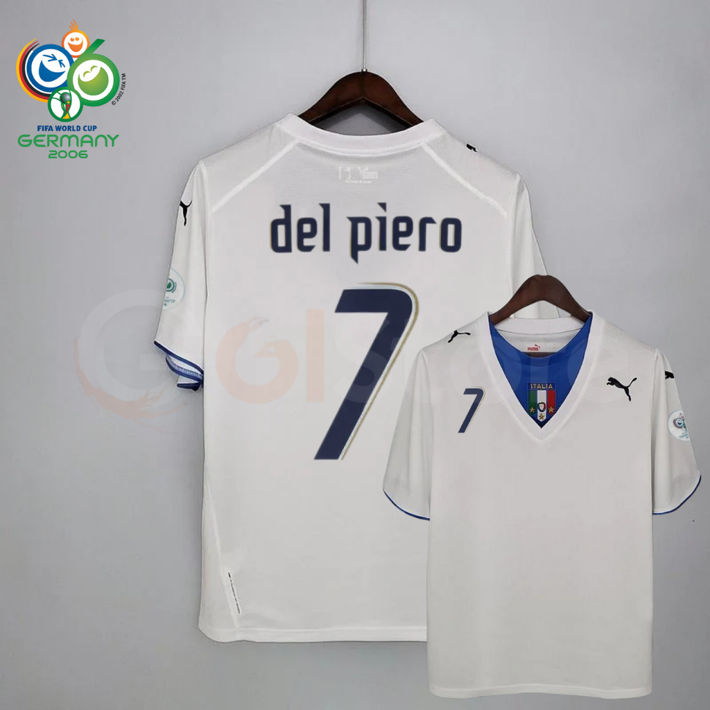 Front and back views of a white Italy short-sleeve retro away jersey with a blue neckline panel, dark Del Piero number 7 print and sleeve patches, alongside a Germany 2006 World Cup graphic.