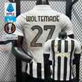 Juventus black and white short-sleeve jersey, front and back views with WOLTEMADE 27 print, white polo collar and gold Jeep detailing.
