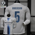  Front and back views of a white Manchester City long-sleeve jersey with blue central stripes, blue Anderson number 5 print and Etihad Airways sponsor, alongside UCL graphics.