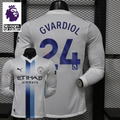 Front and back views of a white Manchester City long-sleeve jersey with blue central stripes and Gvardiol number 24 print, alongside a Premier League graphic.