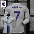 Front and back views of a white Manchester City long-sleeve jersey with blue central stripes and Ndiaye number 7 print, alongside a Premier League graphic.