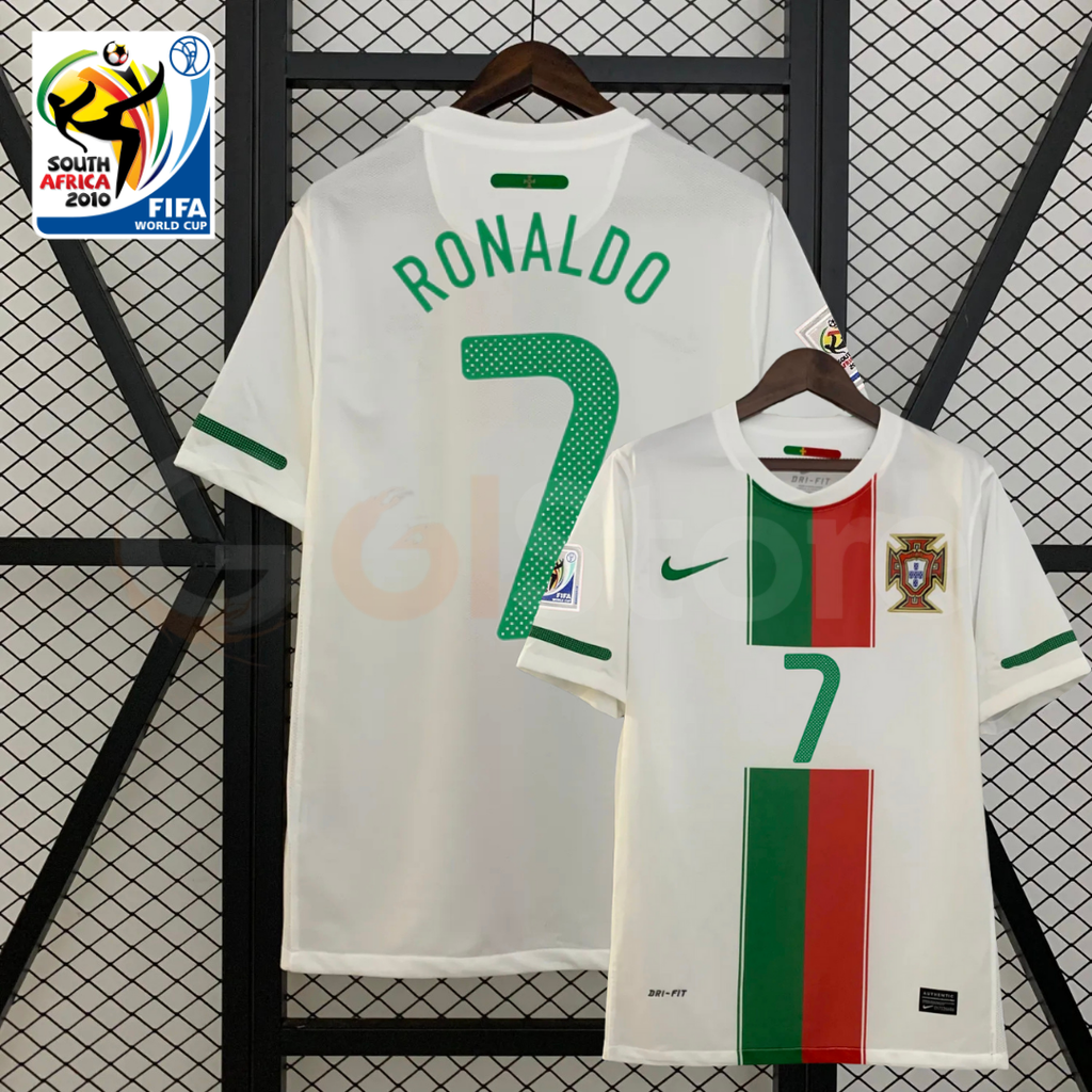 Front and back views of a white Portugal 2010 retro short-sleeve away jersey with green Ronaldo #7 printing, green and red front panels and World Cup sleeve patches.