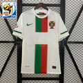Front view of a white Portugal 2010 retro short-sleeve away jersey with central green and red panels, green sleeve trim, Portugal crest and 2010 World Cup sleeve patch.