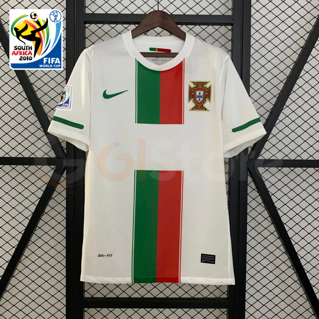 Front view of a white Portugal 2010 retro short-sleeve away jersey with central green and red panels, green sleeve trim, Portugal crest and 2010 World Cup sleeve patch.
