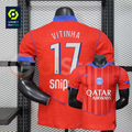 Front and back views of a red PSG short-sleeve jersey with blue trim, white Vitinha number 17 print and Qatar Airways sponsor, alongside a Ligue 1 graphic.
