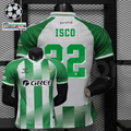Real Betis green and white short-sleeve jersey shown from the front and back, with green ISCO 22 print, GREE sponsor, diagonal details and Champions League and UEFA Foundation sleeve patches.
