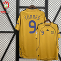 Front and back views of a yellow Spain 2008 short-sleeve away jersey with blue Torres #9 printing, black shoulder stripes and Euro 2008 sleeve patch.