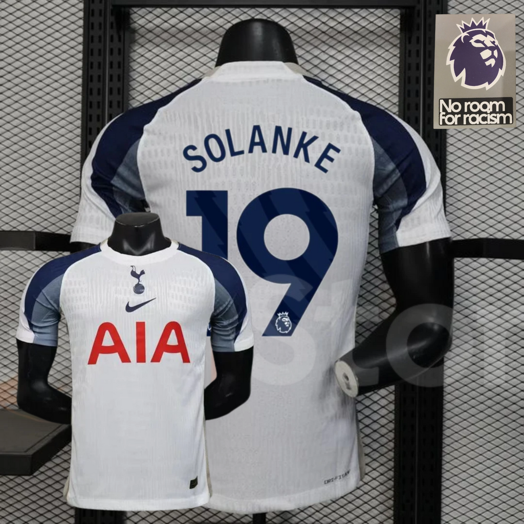 Front and back views of a white Tottenham Hotspur short-sleeve home jersey with navy and grey sleeves, navy Solanke number 19 print and red AIA sponsor.