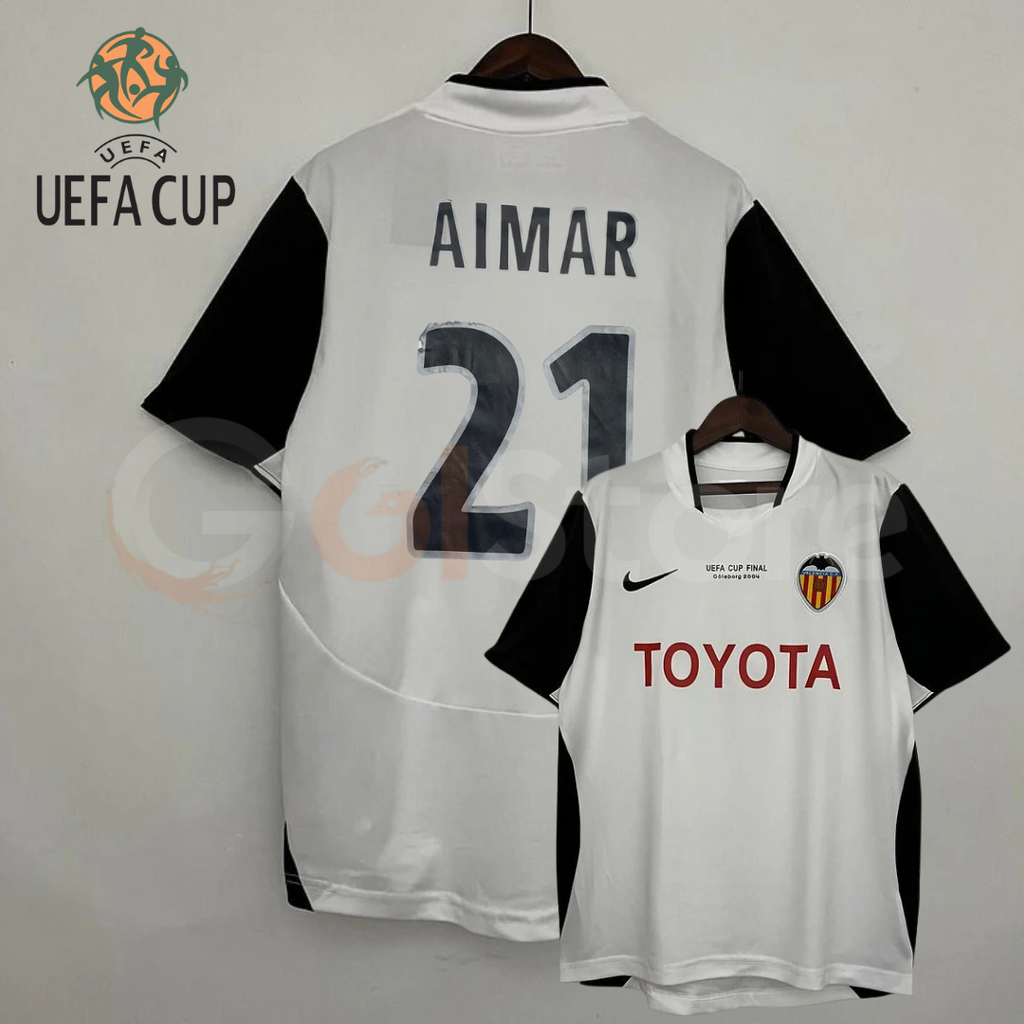 Front and back views of a white Valencia CF short-sleeve jersey with black sleeves, Aimar number 21 print, red Toyota sponsor and UEFA Cup Final Göteborg 2004 chest lettering.